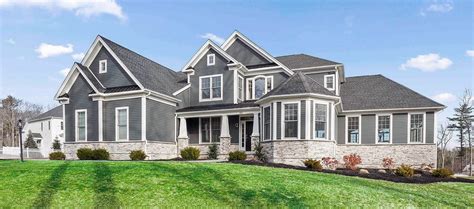 You could try a dark grey for your concrete front porch and a shiny brick red door. Gray House Color Schemes | Exterior Siding Color Combinations