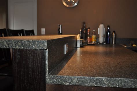 Bar Countertop With Backsplash Ran Flush To Raised Countertop With No