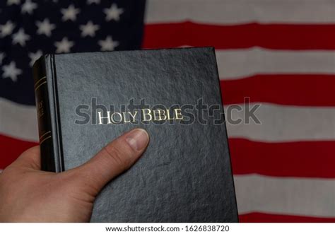 Hand Holding Holy Bible Usa Flag Stock Photo 1626838720 Shutterstock
