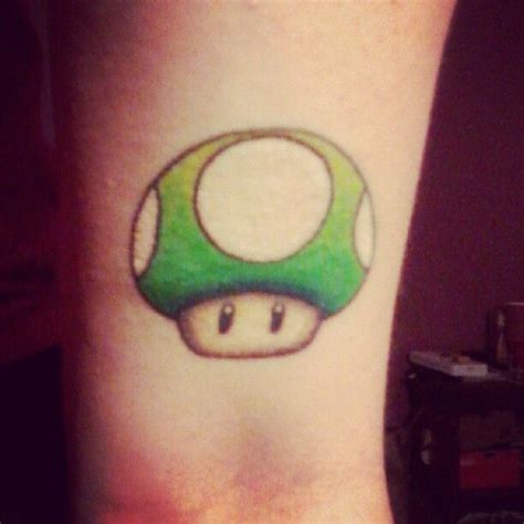 Color mario and mushroom tattoo on left foot. 1up mushroom from Super Mario Bros | Mushroom tattoos ...