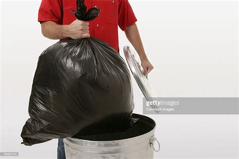 Man Taking Out Trash High Res Stock Photo Getty Images