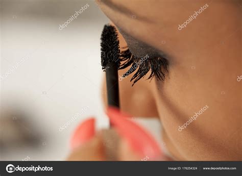 Young Woman Applying Mascara Her Eyelashes — Stock Photo © Vgeorgiev