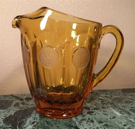 Vintage Glass Pitcher With Coin Medallion Motif Deep Amber In Color 32 Ounce Pitcher