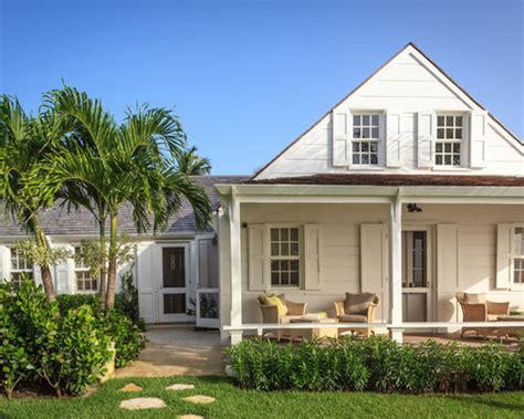Molded plastic shutters in maroon. White Shutters | Houzz