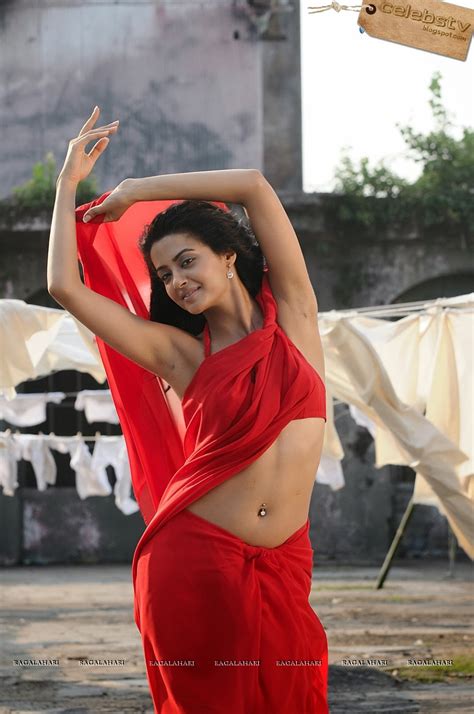 Surveen Chawla Sexy In Red Saree With Nipple Pokie In