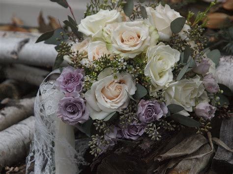 Brides Bouquet With Lavender Spray Roses White And Ivory Roses Wax