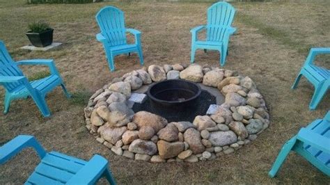 Diy Natural Rock Fire Pit With Tractor Rim Center To Protect Flames