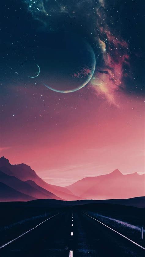 An Empty Road With Mountains And Planets In The Sky At Sunset Or