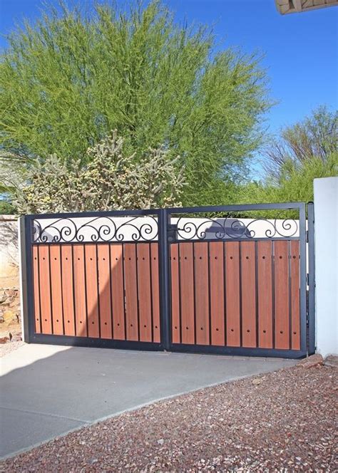 Custom metal gates are also a fantastic option for commercial projects and public properties such as parks, schools, cemeteries, clubs and community centers. Wood and Iron Double Driveway Gate | Exterior Gates ...