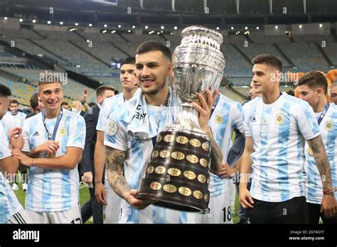Leandro Paredes Of Argentina Celebrates With The Trophy After Winning