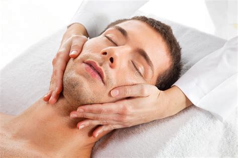 Young Man Receiving Facial Massage Stock Image Image Of Lifestyle