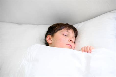 Close Up Portrait Of Child Sleeping In Bed Stock Photo Image Of