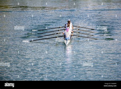 Rowers In Eight Oar Rowing Boats On The Tranquil Lake Stock Photo Alamy