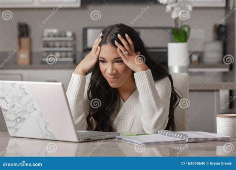 A Frustrated Woman Works From Home On Her Computer Stock Photo Image