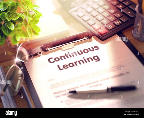 Continuous Learning On Clipboard Stock Photo Alamy