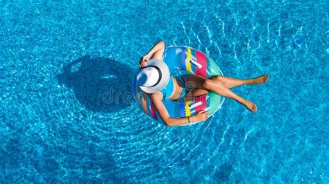 Aerial Top View Of Beautiful Girl In Swimming Pool From Above Relax