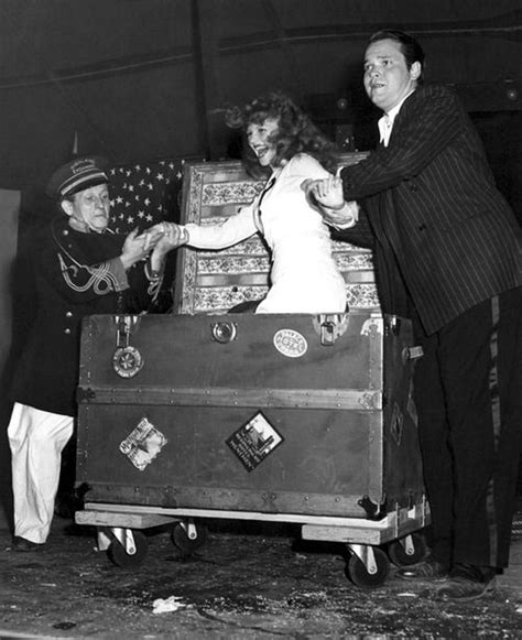 Orson Welles Performs A Magic Trick With Wife Rita Hayworth As His