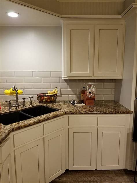What kind of backsplash for baltic brown granite? Kitchen cabinets. Baltic Brown counter. Glazed cream ...