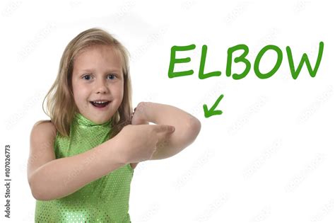 Cute Little Girl Pointing Her Elbow In Body Parts Learning English