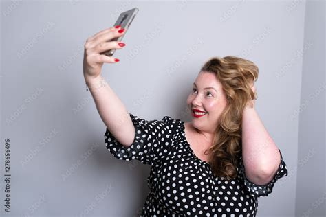 Beautiful Overweight Plus Size Model Taking Selfies For Social Media