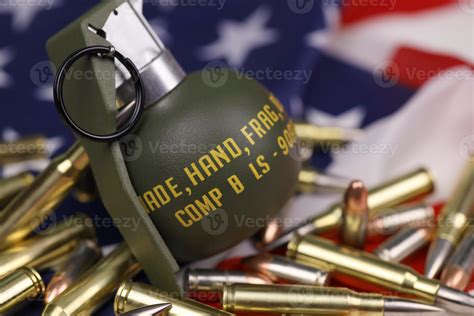 M67 frag grenade and many yellow bullets and cartridges on United