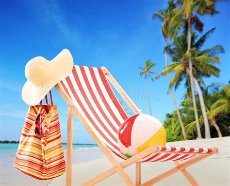 Beach Chair With Accessories On A Tropical Beach With Palms Stock Image