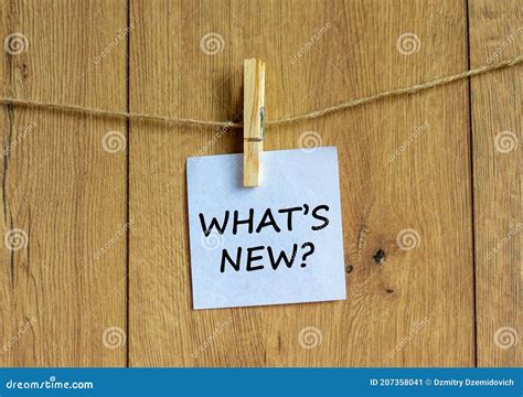 What Is New Symbol White Sheet Of Paper On Wooden Clothespin Words