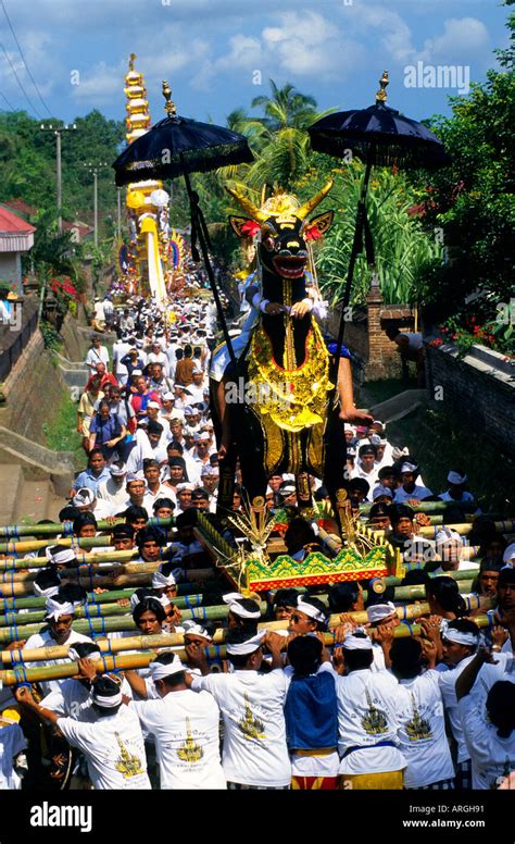 balinese funeral procession body carried to the cremation bamboo paper silk flowers hindu