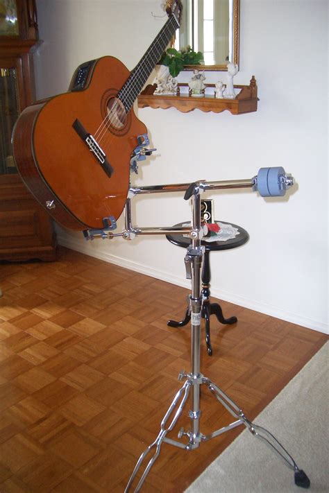 A "walk-up-and-play" guitar stand. Parallel arms and holder fabricated