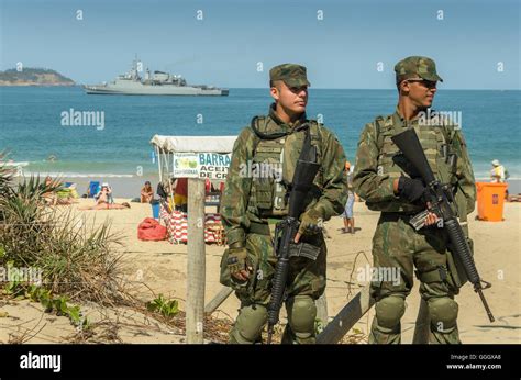 Brazilian Military Police Watch Over Tourists And Locals At Ipanema Beach In Rio De Janeiro