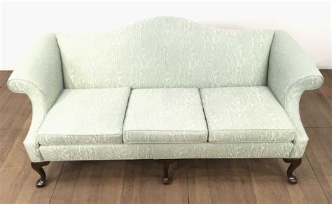 We typically do not reupholster items, but that does vary from location to location. Lot - Ethan Allen Queen Anne Style Camelback Sofa