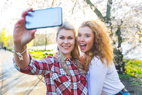 Two Women Taking A Selfie At Park In London Stock Photo Crushpixel