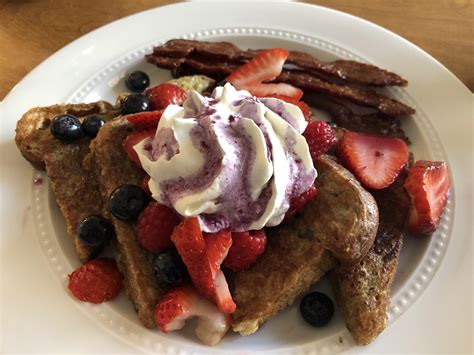 Clementine Spice French Toast With Berries Whip Cream And Cinnamon