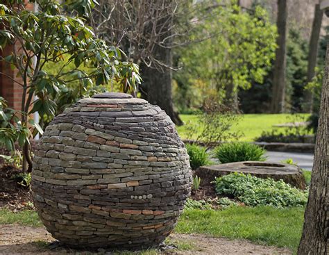 Stacked Stone Garden Spheres By Devin Devine Demilked