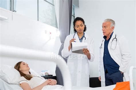 Doctors Consulting With Patient — Senior Man Man Stock Photo