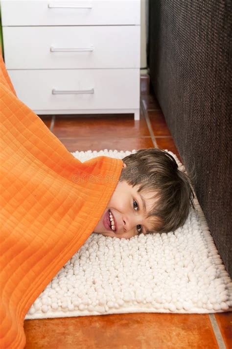 Playful Child Is Hiding Under The Bed Stock Photo Image Of Happy
