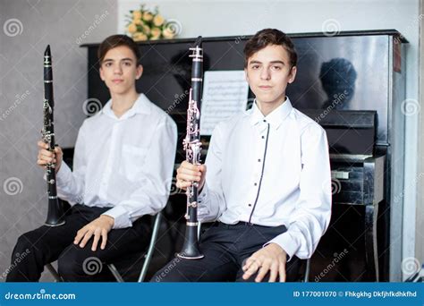 Teenage Boys Play Piano in Class or at Home . Stock Photo - Image of