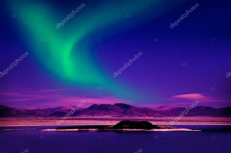 Northern Lights Over Lake — Stock Photo © Surangastock 38125775