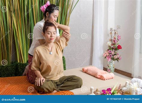 Thai Masseuse Doing Massage For Woman In Spa Salon Asian Beautiful Woman Getting Stock Image