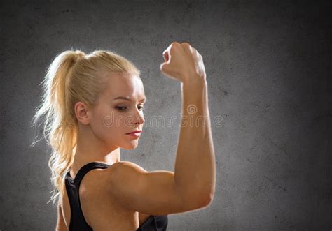 Sporty Woman From The Back Flexing Her Biceps Stock Photo Image Of