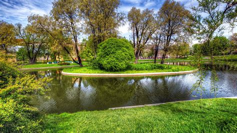Beautiful Greenery Park With Lake And Trees In Building Background Hd