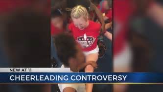 local cheerleaders react to video showing girls forced into splits youtube
