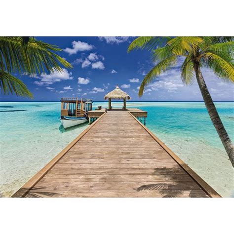 Invite paradise into your décor with this tropical wall mural With a thatched roof dock leading