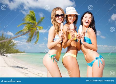 Group Of Smiling Women Eating Ice Cream On Beach Stock Photo Image Of