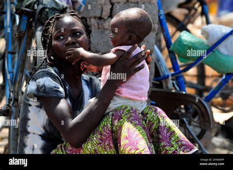 A Burkinabe Woman Wither Her Baby In A Small Village In Central Burkina