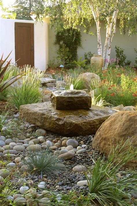 Modern landscaping rocks are perfect to complete a garden decoration. Modern Mediterranean Backyard Makeover On A Budget (2 ...