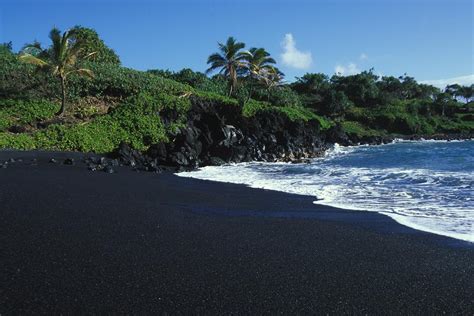 Black Volcanic Sand Beach On Hawaiis Photograph By Paul Nicklen