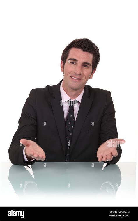 Friendly Businessman Sat At His Desk Stock Photo Alamy