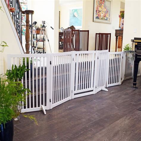 Gate is durable and reasonably priced. WELLAND Freestanding Wood Pet Gate w/Walk Through Door ...