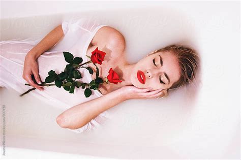 An Attractive Young Woman Lies In Milk Bath By Jovana Rikalo Stocksy United